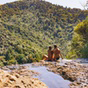 couple is sitting on the edge of the mount